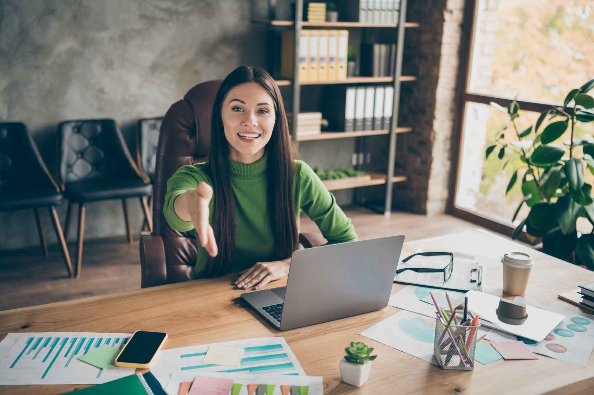 Portrait of her she nice attractive skilled experienced cheerful girl executive, director company owner ceo boss chief giving you hand shake at modern loft industrial interior workplace station