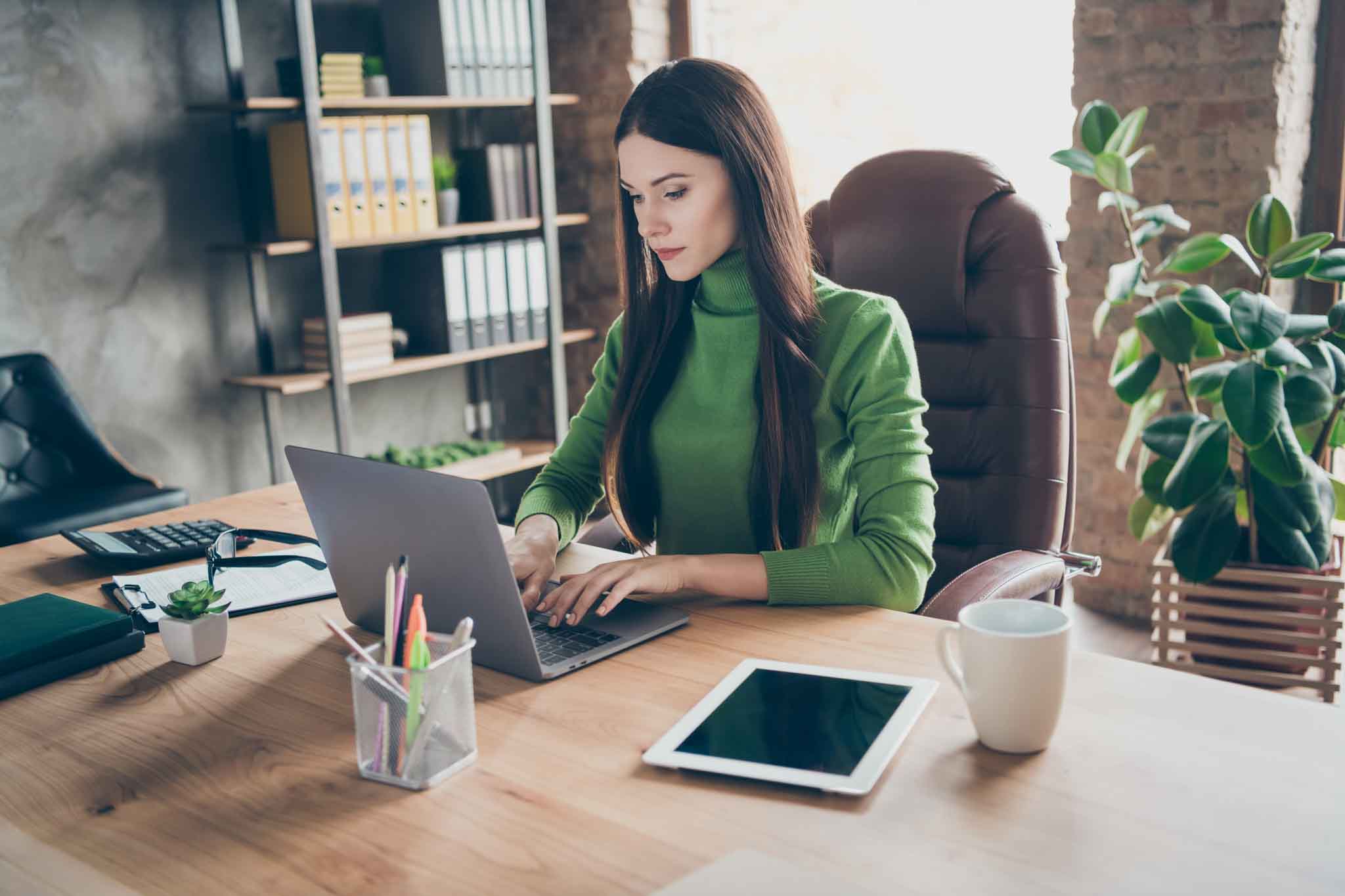 Portrait of her she nice attractive focused serious smart clever intelligent, lady agent broker writing email preparing market research report modern loft industrial style interior work place station