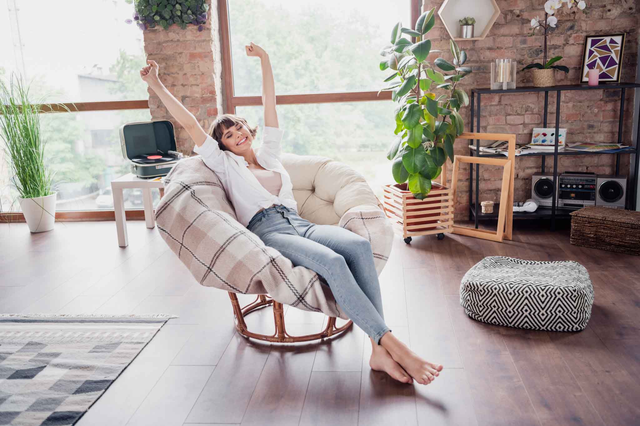 Full length body size photo woman relaxing in armchair on weekend at home chilling smiling