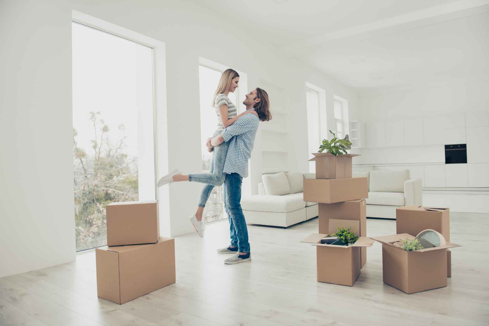 I want to live with you forever! Out dreams come true! Lifestyle modern stylish dreamy trendy loft flat concept. Adorable beautiful attractive excited cheerful joyful couple dancing in new house